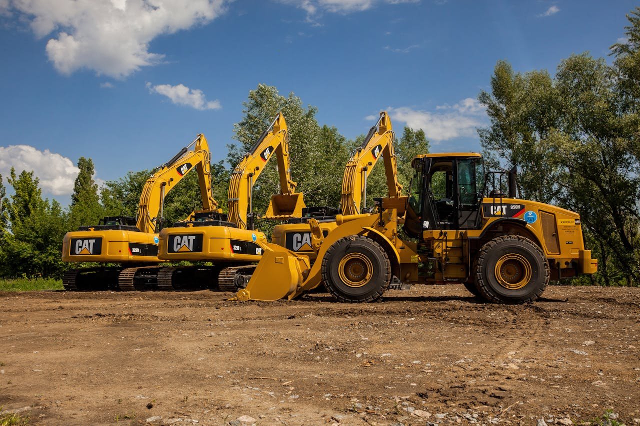 Crafting Captivating Headlines: Your awesome post title goes here Four yellow excavators at an outdoor construction site in Kyiv, Ukraine.